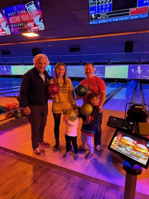 family at bowling alley