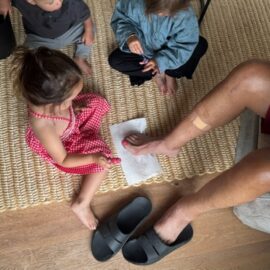 granddaughters painting Neils toenails