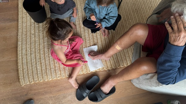 granddaughters painting Neils toenails